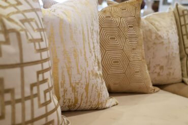 Gold pattern pillows on sofa