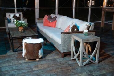 Brown Cowhide Stool | Perch Event Decor | Luxury Furniture Rentals in Dallas Texas | Rustic Southern Brown and White Cowhide Stool