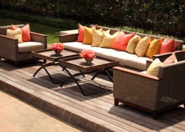 Kingsley Sectional and Chair + Rustic Coffee Table | Perch Event Decor | Luxury Furniture Rentals in Dallas Texas | Outdoor Collection | Wicker Sofa or Sectional with Wicker Chairs and A Modern Wood and Iron Coffee Table