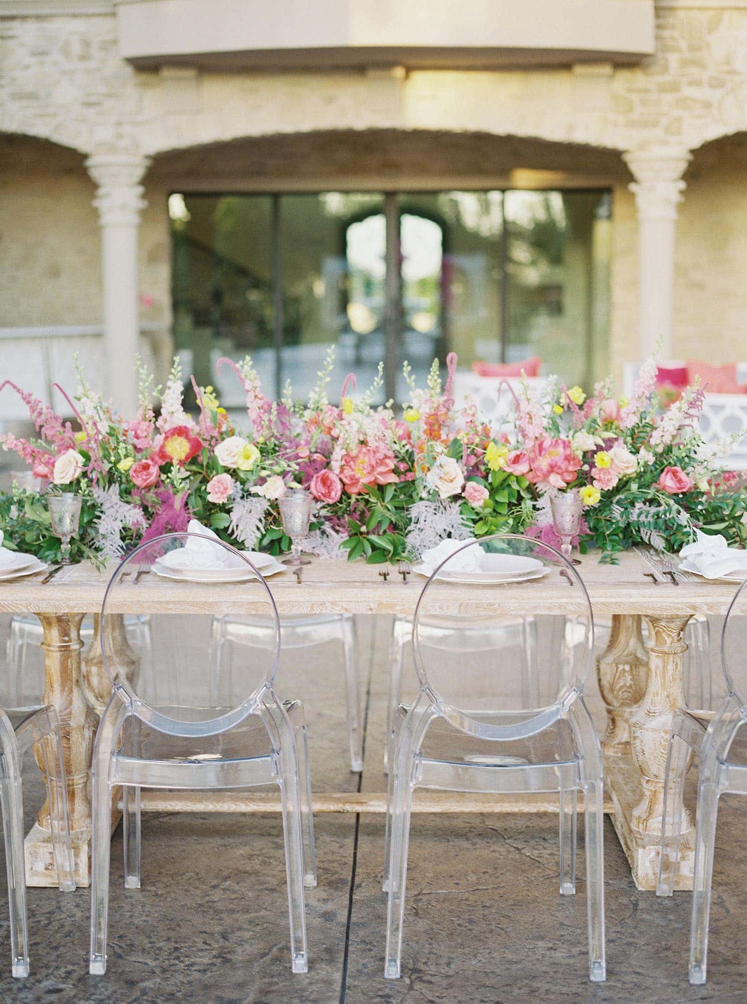 Tuscany Table with Flowers and Ghost Arm Chairs