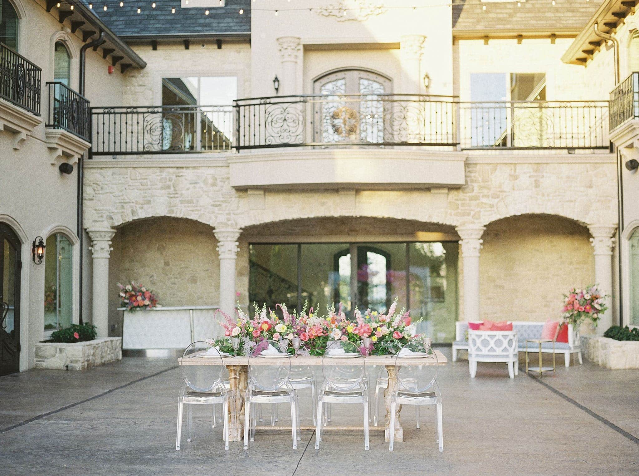 Ghost Arm Chairs and Tuscany Table with Flowers