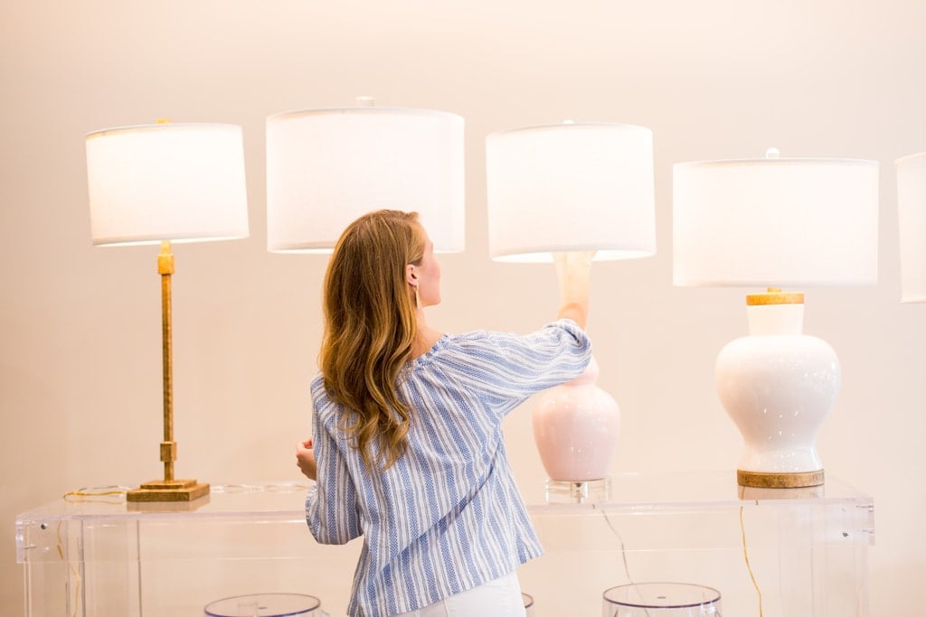 Kate from Lonestar Southern browses lighting options at the Perch Decor showroom in Dallas