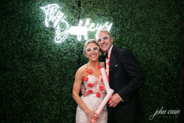Boxwood Walls with Neon Sign at Brook Hollow Golf Club Wedding