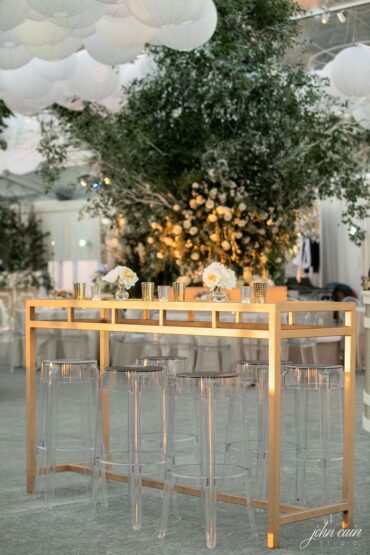 Gold and Mirrored Communal Table with Ghost Barstools at Midland Country Club Wedding