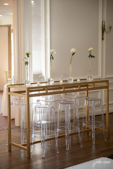 Gold and Mirrored Communal Table with Ghost Barstools and Ghost Barstools with Back at Brook Hollow Golf Club Wedding