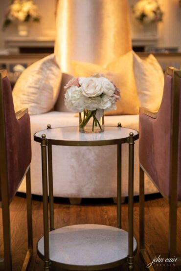Marble Accent Table with Blush Dakota Chairs, Kate Tete a tete, and Perch Pillows at Brook Hollow Golf Club Wedding with floral by Garden Gate