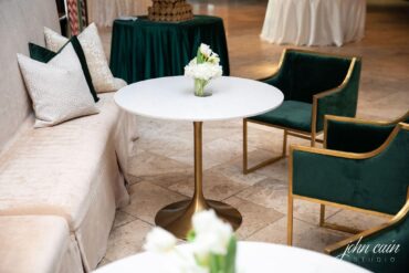 Marble and Gold Bistro Table with Delano Champagne Banquette and Emerald Dakota Chairs and Perch Pillows at Dallas Country Club Wedding
