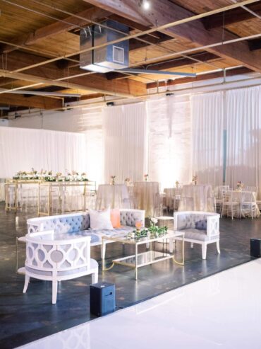 Beverly Sofa, Beverly Chairs, and Gold and Glass Coffee Table at Sixty Five Hundred Wedding