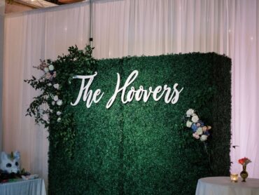 Boxwood Walls with Sign at Sixty Five Hundred Wedding | Greenery Wall