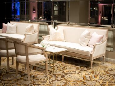 Phillip Arm Chair with Edward Sofa and Perch Pillows and Lindsey Coffee Table with White Marble Top at Kirstin Rose Events Wedding at The Adolphus