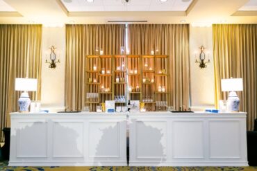 Convertible Hampton Bar Facades with Ginger Jar Lamps and Gold Shelves at River Crest Country Club Wedding with Branching Out Events | White Bars | Double Bar