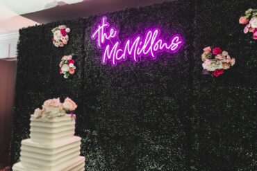Boxwood Walls with Neon Sign at Abilene Country Club Wedding | Kelsey Dell Events