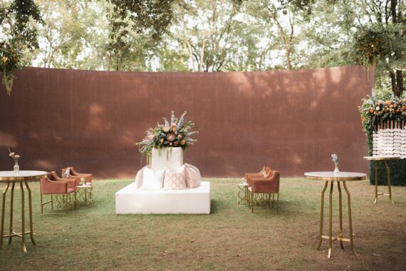 Tayler Tete a tete with Blush Dakota Chairs, Pair of Gwyn Accent Tables, Scarlett Cocktail Table, Boxwood Wall, and Perch Pillows at a Nasher Sculpture Center wedding