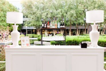 White and Acrylic Lamps on Convertible Hampton Bar Facade at Marie Gabrielle | Ivory & Vine Event Co.