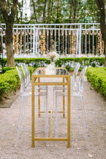 Gold and Mirrored Communal Table with Ghost Barstools with Back at Marie Gabrielle | Anna Eisenlohr Events