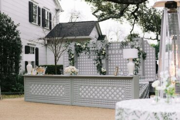 Trellis Wall behind the Lattice Bars with White and Acrylic Lamps | Cloche Events | San Antonio Wedding