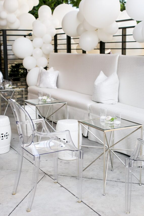 Tayler Banquettes with Silver Star Accent Tables, Ghost Arm Chairs, and White Garden Stools at The Ripley Building | Brock & Co. Events