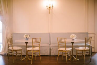 Madeline Banquettes with Marble and Gold Bistro Table at Brook Hollow Golf Club | Park Cities Events