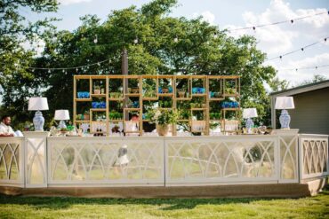 Amelia Bar Facade with Amelia Bar Columns and Corner Pieces, Ginger Jar Lamps, and Gold Shelves | Cloche Events | San Angelo Wedding