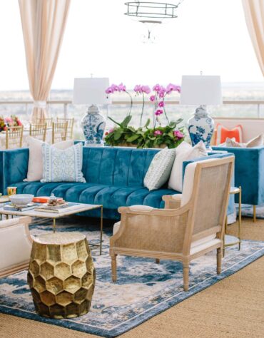 Belmont Sofa with Edward Sofa, Edward Cane Back Arm Chair, Marble Bamboo Coffee Table, Gold Honeycomb Stool, Marble Accent Table, and Blue and White Porcelain Lamps | Cloche Events | San Angelo Wedding