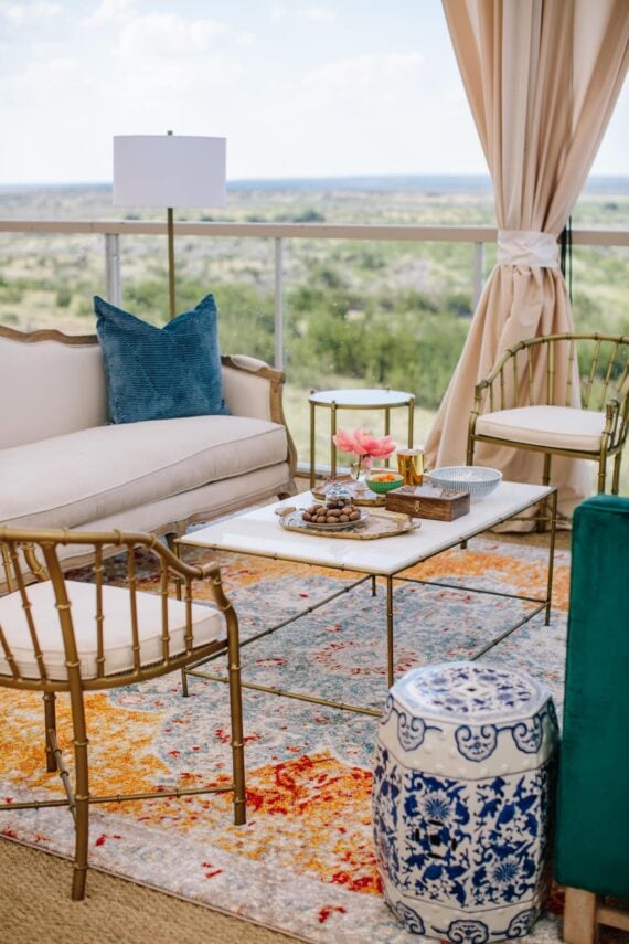 Diana Sofa with BLUE 044, Marble Bamboo Coffee Table, Brass Bamboo Arm Chair, Marble Accent Table, and Blue and White Stool | Cloche Events | San Angelo Wedding