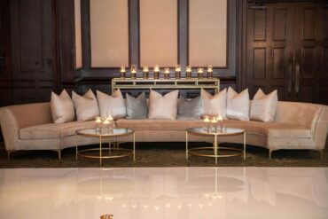 Charlotte Banquette with center piece, Olivia Coffee Table, Gold and Mirrored Communal Table, Perch Pillows at Dallas Country Club | Weddings a la Carte | Garden Gate Floral