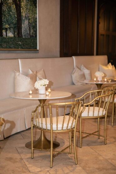 Tayler Banquettes with Marble and Gold Bistro Tables and Brass Bamboo Arm Chairs at Dallas Country Club | Weddings a la Carte | Garden Gate Floral