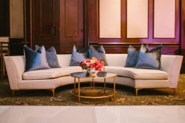 Lauren Banquette with Olivia Coffee Table with Perch Pillows at Dallas Country Club | Caroline Jurgenson Photography | Garden Gate Floral