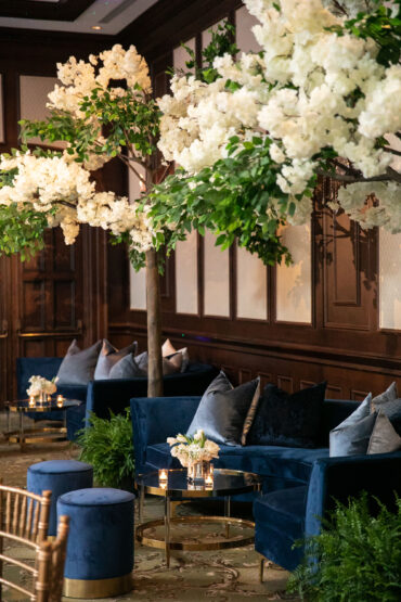 Natalie Banquette with Brittany Coffee Table and Navy Stella Stools at Dallas Country Club | Garden Gate Floral | John Cain Photography