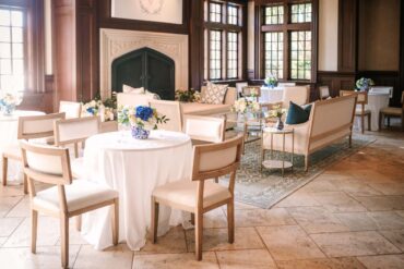 Charles Dining Chairs, Edward Sofa, Marble Accent Table, Gold and Glass Coffee Table at Dallas Country Club | Garden Gate Floral