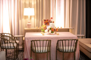 Straight Charlotte Banquette with Brass Bamboo Arm Chairs and Rose Lamp at Four Seasons Vail | Elizabeth Events Co