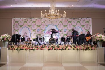 Hampton Stage Facade with the Newport Backline at Brook Hollow | Weddings a la Carte | Garden Gate Floral