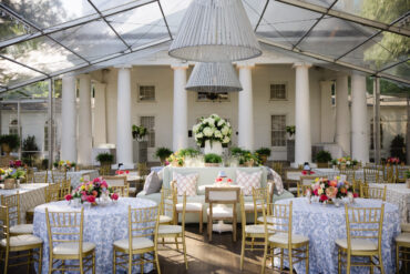 Poppy Banquettes with White Bistro Tables, Charles Dining Chairs, and PINK 026 pillows at Arlington Hall | Kirstin Rose Events | Three Branches Floral