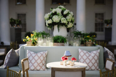 Poppy Banquette with White Bistro Table and Charles Dining Chairs at Arlington Hall | Kirstin Rose Events | Three Branches Floral