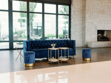 Luke Sofa with Marble Accent Table and Navy Stella Stools at Omni Barton Creek | Elsie Event Co