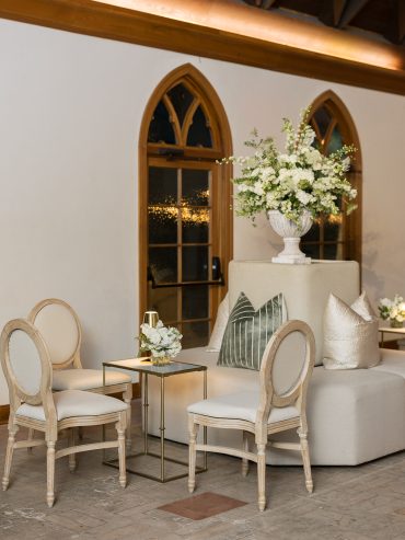 Kirstin Tete a tete with GREEN 017 pillows, IVORY 006 pillows, Edward Dining Chairs with Natural Linen Cushions, Rectangular Marble Side Tables, and Gold Martini Lamps at Commodore Perry Estate | Pearl Events Austin