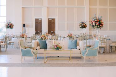 Linen Sophia Sofa with Gold and Glass Coffee Table and Green Louis Arm Chairs at The Bowden | Clara Elaine Events
