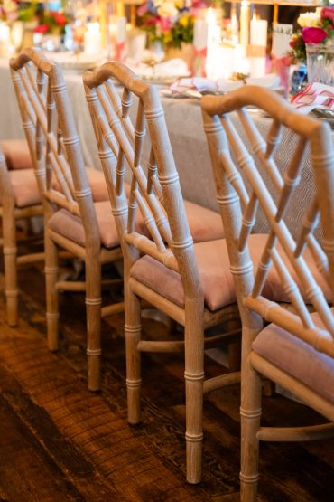 Natural Wood Gracie Dining Chairs with Blush Velvet Cushions at Hotel Drover | Honey and Co. Weddings