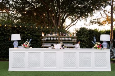 Convertible Hampton Bar Facades with Custom Vinyls and Ginger Jar Lamps at Hotel Drover | Honey and Co. Weddings